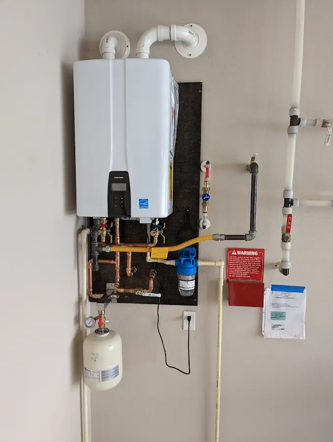 Professional plumber installing copper piping in a San Rafael home